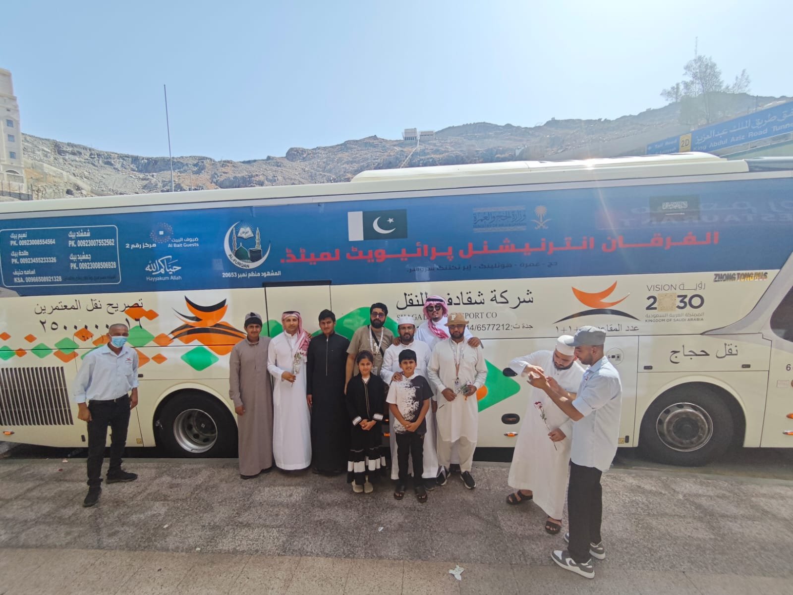 Al-Furqan Hajj tour guide and team with pilgrims